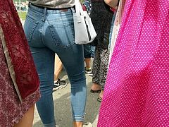 This hot teen is walking around the street in this amazing tight jeans showing her perfect round booty in candid footage