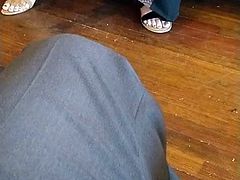 Two pairs of Muslim feet at cafe