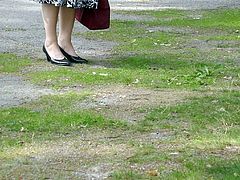 Wife walking in black classic high heeled pumps