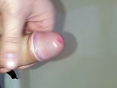 Slow stroking cum covered cock