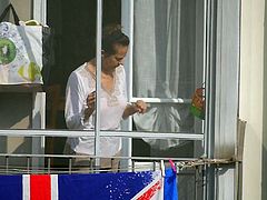 Mature lady in pajamas on the balcony II