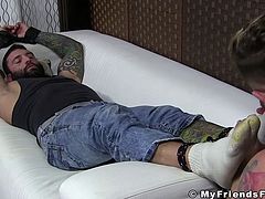 Stud gets tickled on his feet by his partner and then he also gives him a satisfying foot job too.