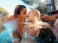 Roxie and Chloe are having a fun dip in the water. They kiss passionately and play with each other’s boobs. After seeing who can hold their breath the longest, they put down a towel so they can eat pussy.