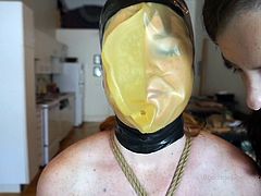 This big titty lesbian hottie came over to her brunette neighbour's house to chat with her a lil. But when she got to the dom brunette hottie's place, the slender babe tied her all up instead and put a latex mask on her face before fingerfucking the busty beauty while her big titties were all tied up.