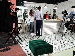 This kinky brunette babe is a director working for an ad film company and today, she was on set when she spotted a hot cameraman. As soon as she got a chance, she snuck over to him and whipped his dick out to blow on it, after which she bent over and let him dick her down in the middle of the set.